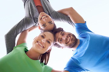 Image showing Team, huddle and people in fitness with low angle portrait, workout together and support for health outdoor. Solidarity, sports and community training, exercise friends with smile and wellness