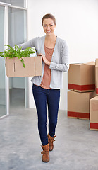 Image showing Office assistant, woman and box with plant at work in smile, decoration and moving in for start up business. Workspace, joy and happy with green initiative for healthy environment and positivity