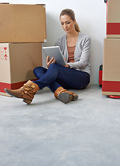 Image showing Business, thinking and woman with a tablet, boxes and digital app with typing, decision and startup. Person, employee and entrepreneur with technology or choice with courier or ideas with internet