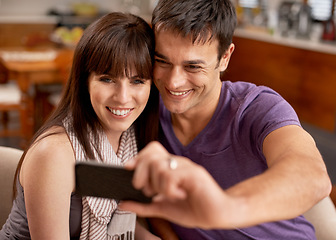 Image showing Love, hug and happy couple with selfie in house for bonding, photography or memory with care. Smartphone, profile picture or people embrace with romance at home for social media, blog or vlog update