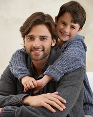 Image showing Sofa, hug and portrait of father and kid for bonding, happy relationship and relax together in home. Family, parents and dad embrace young son on couch for love, childcare and smile in living room