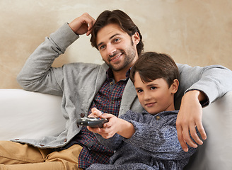 Image showing Happy, TV and father and child on sofa with remote for bonding, relationship and relax in living room. Family, parents and dad with young son for cartoon, watching movies and entertainment in home