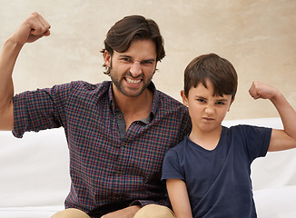 Image showing Sofa, muscle and portrait of father and child flex for bonding, fun childhood and relax together. Family, home and strong dad with young son on couch for love, care and support in living room