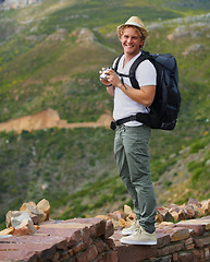 Image showing Happy man, portrait and hiker with binoculars and bag for sightseeing, outdoor travel or hiking in nature Young male person or tourist with hat, backpack or optical tool for view, scope or exploring