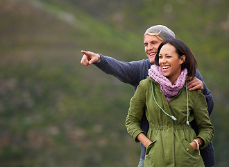 Image showing Happy couple, pointing and nature in adventure for sightseeing, journey or outdoor view together. Man and woman with smile enjoying holiday, vacation or getaway in natural environment on mockup