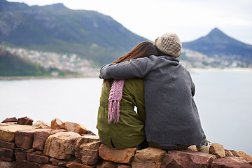 Image showing Couple, back and nature with mountain, hug and lake for road trip or holiday. Woman, adventure and vacation with embrace, happiness and journey for tourism or hiking with travel and view for date