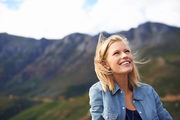 Image showing Woman, smile and vacation in nature for mountain as tourist in Cape Town to relax and peace. Female person, happiness and excited for adventure on road trip for holiday, getaway and freedom outdoor