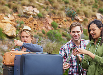 Image showing Friends, luggage and car for travel road trip for camping holiday for explore, mountain or vacation. Men, woman and unloading bags at transportation in Italy or outdoor, safety straps or suitcase