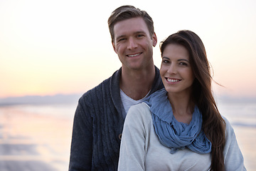 Image showing Portrait, love and couple on beach at sunset with happiness together on holiday in Florida. Travel, vacation and man hug woman outdoor on date in summer with care, support and kindness in marriage