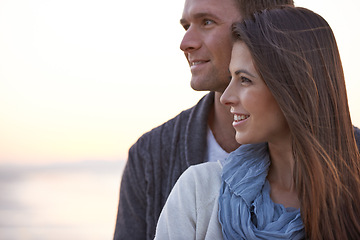 Image showing Couple, thinking and hug with love outdoor at sunset planning future holiday together in Florida. Travel, ideas and man with woman on beach, vacation or date in summer with support in marriage