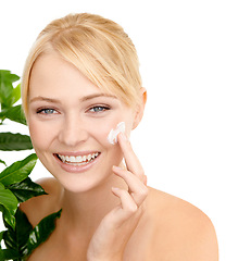 Image showing Lotion on face, leaves and woman with beauty for dermatology organic cosmetics and smile on white background. Portrait, cream or sunscreen with green plant for eco friendly skincare and moisturizing