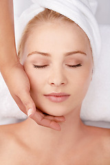 Image showing Face, massage and woman at a spa with hands of masseuse for lymphatic drainage procedure from above. Zen, peace and female with facial therapy at beauty salon for skincare, wellness or stress relief