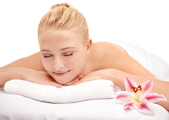 Image showing Relax, rest and woman at spa with flower for luxury holistic treatment, facial health and professional massage therapy. Self care, peace and refresh for girl on bed in natural sleep for body wellness