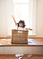 Image showing Flying, playing and child with paper plane fantasy and imagination with fun in basket in home. Adventure, little pilot and playful boy in box with future dream, growth and development with airplane