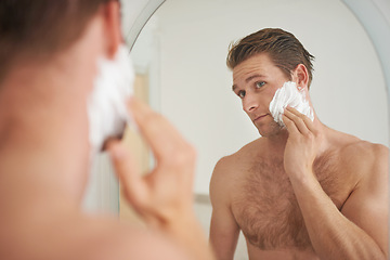 Image showing Mirror, skincare and man with shaving cream application in a bathroom for morning, routine or hygiene. Hair removal, foam and male person in a house with facial product for beauty, wellness or care