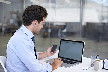 Image showing Businessman, laptop and screen with office, smartphone and technology for communication. Accountant, startup and company with computer, phone and employee for online workspace with corporate