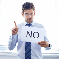 Image showing Portrait, business and man with no sign, accountant and company review with warning and symbol with hand gesture. Face, employee or entrepreneur with a board and deny with reject, paper or feedback