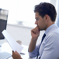 Image showing Businessman, paperwork and reading at desk or report review as consultant for finances, investment or budget. Male person, thoughts and legal document in New York or office, brainstorming or project