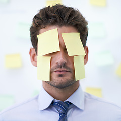 Image showing Man, sticky note and face for business stress as schedule reminder or list for meeting, deadline or brainstorming. Male person, employee and paper or New York corporate for memo, anxiety or burnout