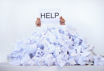 Image showing Person, office and hands with pile of paperwork, sign and help with burnout, stress and administration. Debt, bills and worker lost in documents, overworked and overwhelmed with pressure at desk.