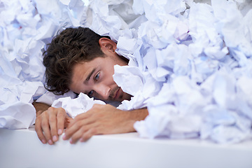 Image showing Man, desk and tired with pile of paperwork, crisis and report with burnout, stress and administration. Fatigue, audit and person lost in documents, overworked and overwhelmed with pressure in office.