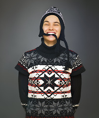 Image showing Happy, fashion and portrait of woman in studio with smile for winter style, trendy clothes and outfit. Attractive, isolated and person in hat with confidence, pride and joy on gray background