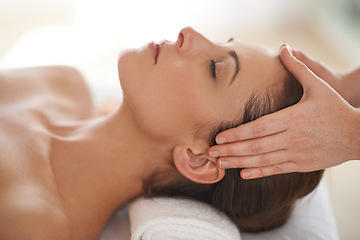 Image showing Hands, head massage and woman at spa to relax, wellness and calm at luxury resort for therapy with masseuse for health. Closeup, face and person at salon for facial treatment, skincare and beauty