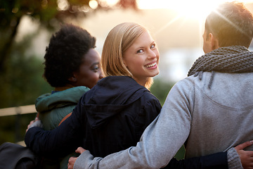 Image showing University, friends and portrait with hug or happy for bonding, relax and break on campus with diversity. College, people and smile with embrace for support, education and learning fun with rear view