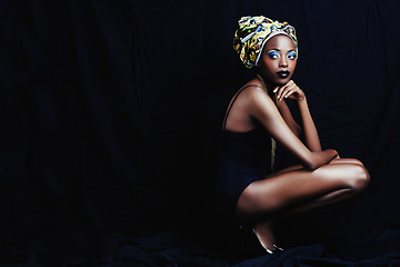 Image showing Black woman, turban and thinking with fashion, head scarf and mockup in studio. Cosmetics, trendy and style with African female person from Kenya with traditional silk wrap with dark background