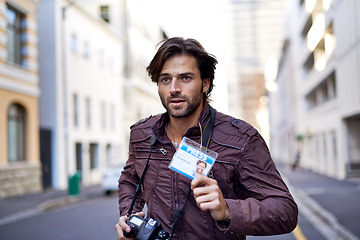 Image showing Photographer, journalist and news with man in city for running, press badge and paparazzi. Reporter, story and pictures with person and camera in urban outdoors for announcement and investigation