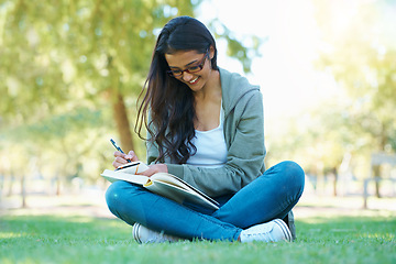 Image showing Writing, grass or happy woman in nature with notes for learning knowledge, information or education. Smile, diary journal or student in park for studying idea or peace on college campus lawn to relax