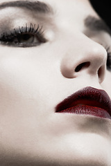 Image showing Woman, studio and face closeup in gothic makeup for beauty, cosmetics and zoom of skincare with dark aesthetic. Young model with red lipstick for cool, art or Victorian style on a black background