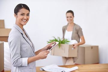 Image showing Portrait, women and moving to office with smile, tablet and opportunity for entrepreneurship together. Computer, startup and business people with box for relocation, new workplace and partnership.