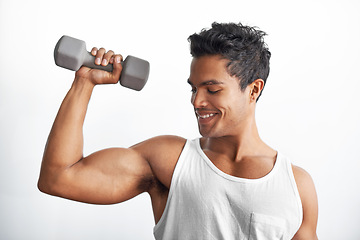 Image showing Gym, fitness and happy man with dumbbell in studio for weightlifting, sports or resilience on white background. Training, face or male bodybuilder with space for power, performance or bicep challenge