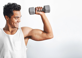 Image showing Fitness, gym and happy man with dumbbell in studio for weightlifting, sports or mockup on white background. Training, face or male bodybuilder with space for power, performance or bicep challenge