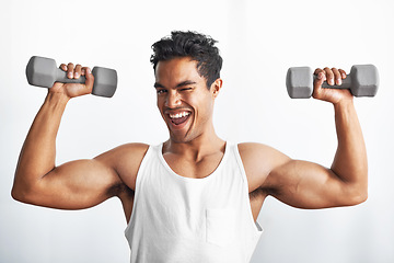 Image showing Fitness, portrait and happy man with dumbbell in studio gym for weightlifting, sports or strength on white background. Training, face or male bodybuilder with power, performance or bicep challenge