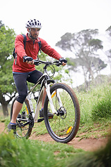 Image showing Fitness, bike and man cycling in off road for adventure, discovery or mountain biking hobby. Exercise, health and sports with young cyclist on bicycle in nature for cardio training or workout