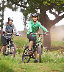 Image showing Happy woman, portrait and friends with bicycle on field for sports, fitness or outdoor cycling in nature. Female person, athlete or cyclist in forest for off road workout, training or cardio exercise