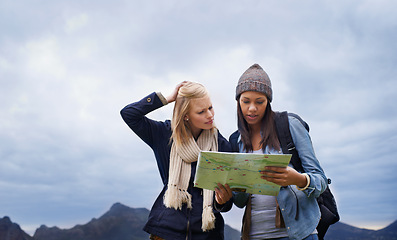 Image showing Woman, friends and thinking with map for direction or location on hiking adventure together in nature. Young female person, hiker or team lost with travel guide for destination, route or outdoor path