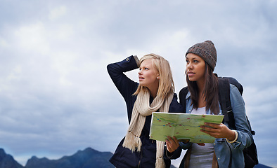 Image showing Woman, friends and thinking with map for lost direction, location or hiking adventure together in nature. Young female person, hiker or team with travel guide for destination, route or outdoor path