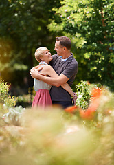 Image showing Happy, hug and couple in a park with love, trust and support, solidarity and security while bonding in nature. Commitment, care and people embrace on a field of flowers for spring romance or date