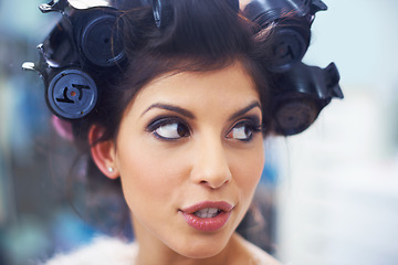 Image showing Woman, face and hair curlers with makeup for beauty in salon with haircare, self care or cosmetology. Model, person or hairstyle for morning routine, curling or getting ready for wellness or grooming