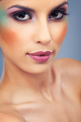 Image showing Creative, makeup and portrait with woman in colorful cosmetics in studio and gray background. Beauty, cosmetics and model with unique identity or rainbow aesthetic with confidence in skincare