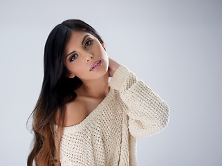 Image showing Woman, fashion and hair, portrait and makeup in studio for winter style salon with treatment and wellness on white background. Cosmetics, trendy jersey or sweater with haircare, volume and growth