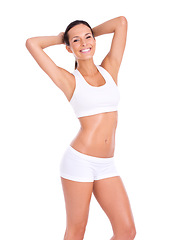 Image showing Body, portrait and woman in underwear for fitness, health and wellness with smile in studio. Diet, exercise and happy girl in sportswear for self care, weight loss and confidence on white background.