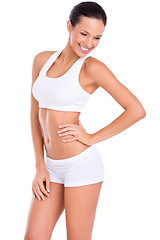 Image showing Body, smile and woman in underwear for fitness, health and wellness with benefits in studio. Diet, exercise and happy girl in sportswear for self care, weight loss and results on white background.