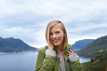 Image showing Woman, hiking and mountains for outdoor travel with wellness, fitness and location in Finland for eco friendly tourism. Young person with backpack for trekking, journey and thinking of her adventure