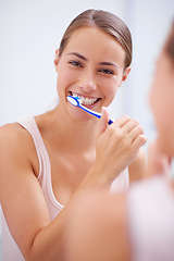 Image showing Portrait, smile and toothbrush for oral hygiene care with woman in bathroom of home for teeth whitening. Face, dental care and happy young person in apartment to prevent tooth decay or gum disease