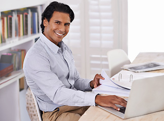 Image showing Businessman, laptop and portrait with paperwork in home for remote work, research or online planning in workspace. Financial analyst, person and technology with sales project, happiness and documents