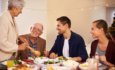 Image showing Christmas, big family and eating lunch in home, smile and bonding together at party. Xmas, food and senior parents at table for festive celebration, relax and people on holiday with salad for meal